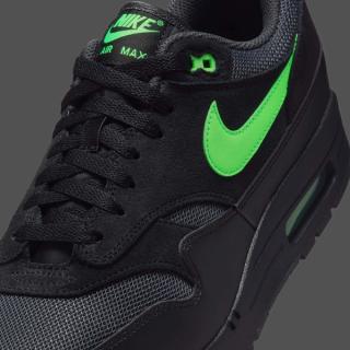 Close-up view of Nike's Air Max 1 in a "Black/Green Strike" color scheme.