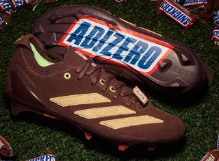 Snickers x adidas Adizero Electric+ II U.S. football cleats ready for Halloween 2026.