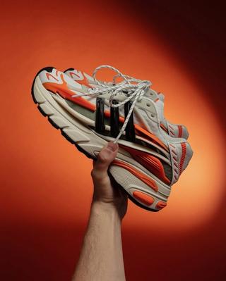 Pharrell Williams' Adidas Adistar Jellyfish in an orange color scheme, shot by Tyler Mansour.