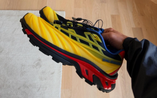 In-hand look: Kith x Salomon XT-EVO in a yellow, red & blue color scheme.