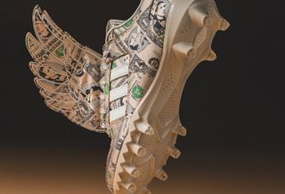 Jeremy Scott's adidas Forum Low Wings "Money" U.S. Football Cleats.