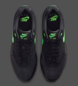 Top-down view of Nike's Air Max 1 in a "Black/Green Strike" color scheme.