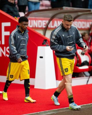 Manchester United players wearing custom viral adidas Chinese New Year Jacket in grey on May 9, 2026.