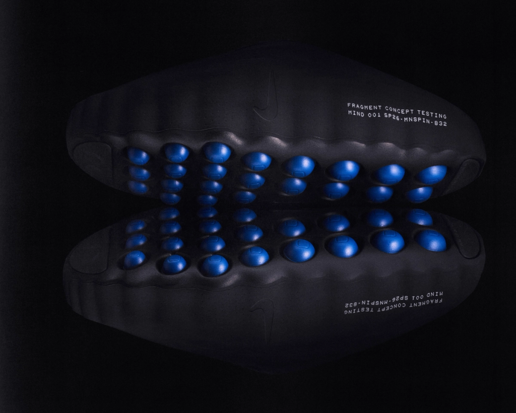 Fragment Design x Nike Mind 001 Mule in neutral colorway, showcasing the slip-on silhouette and minimalist design details