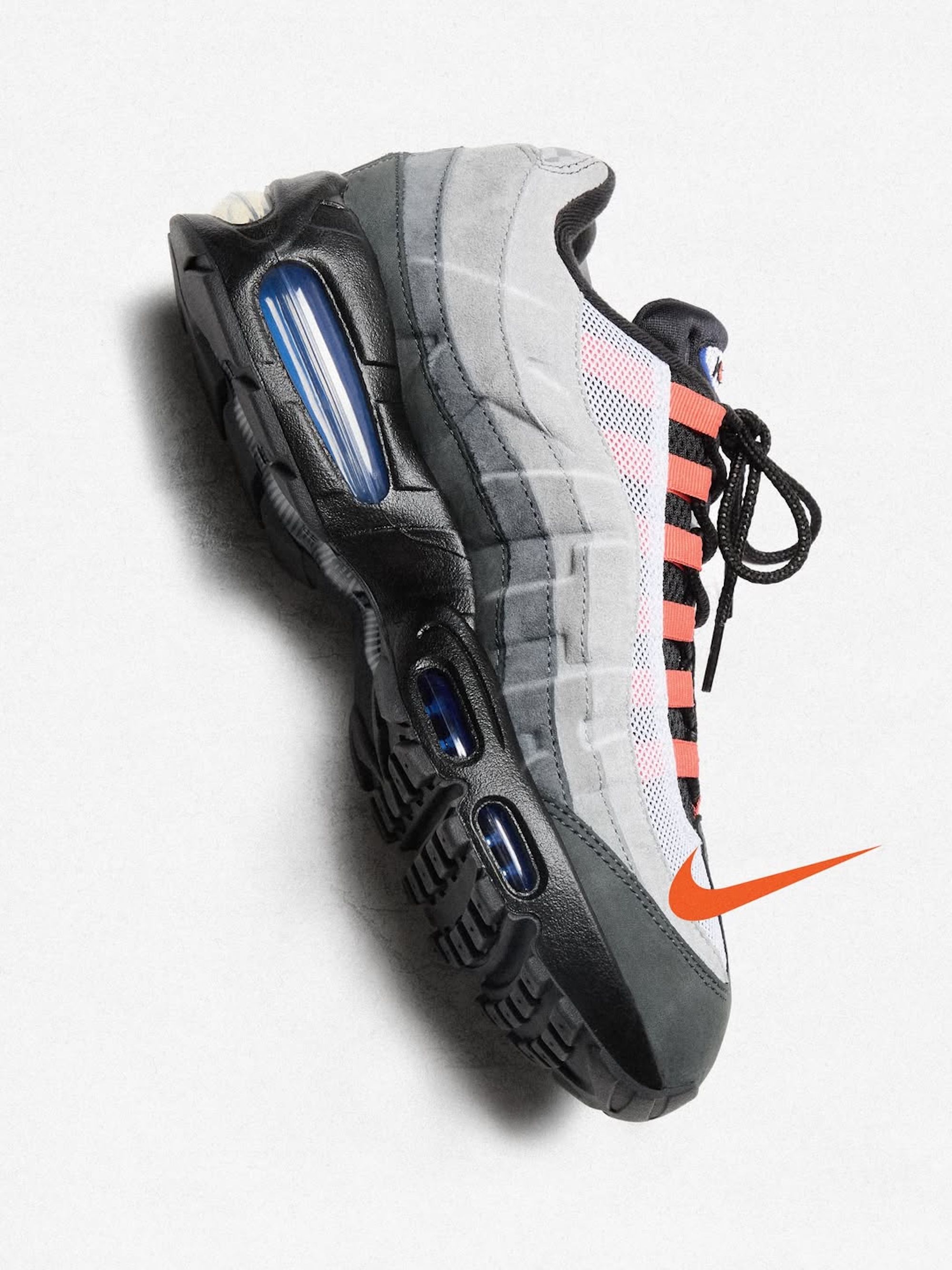 A grey, blue, and orange-colored Kith x Nike Air Max 95.