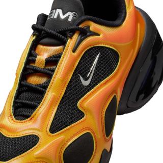 Close-up view of Nike's Air Max Muse in a yellow, black, and red color scheme.