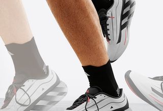 adidas HyperBOOST Lite running shoe with hollowed-out, sculpted midsole reminiscent of On's shoes.