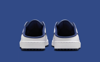 Heel angle of Air Jordan 1 Mule Golf shoe in a "White/Midnight Navy" color scheme.