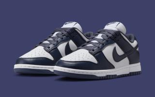 Women's Nike Dunk Low covered in a "White/Thunder Blue" color scheme.