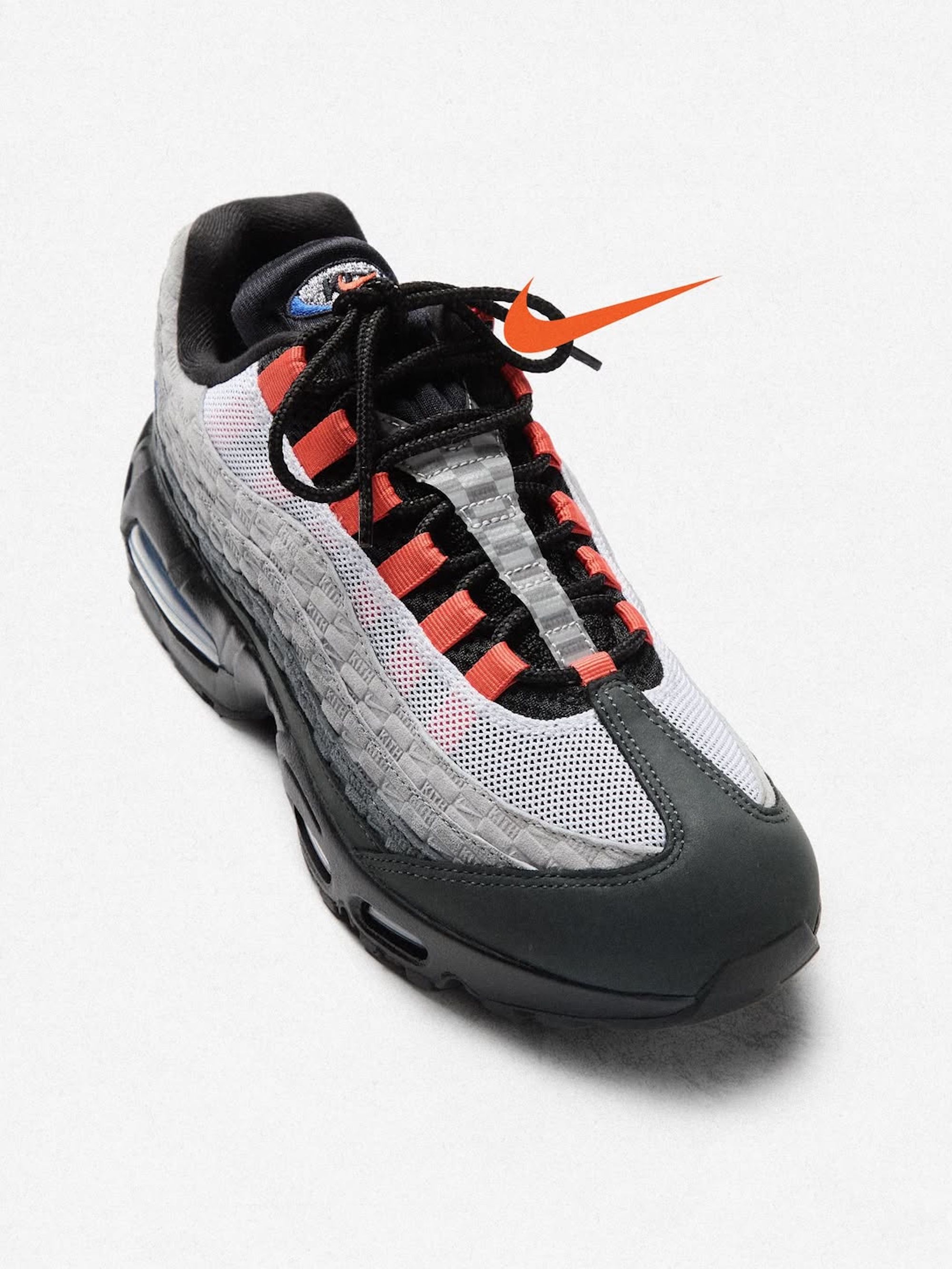A grey, blue, and orange-colored Kith x Nike Air Max 95.