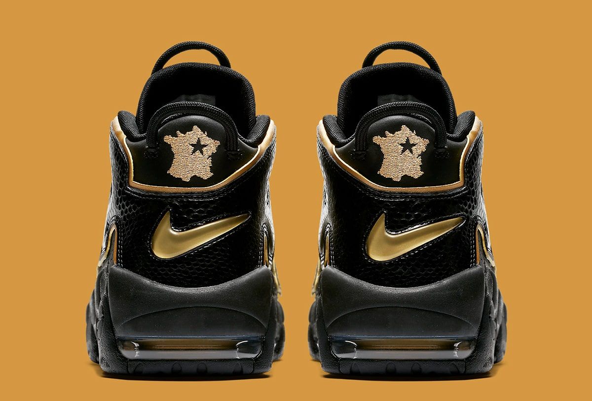 Nike uptempo black and on sale gold