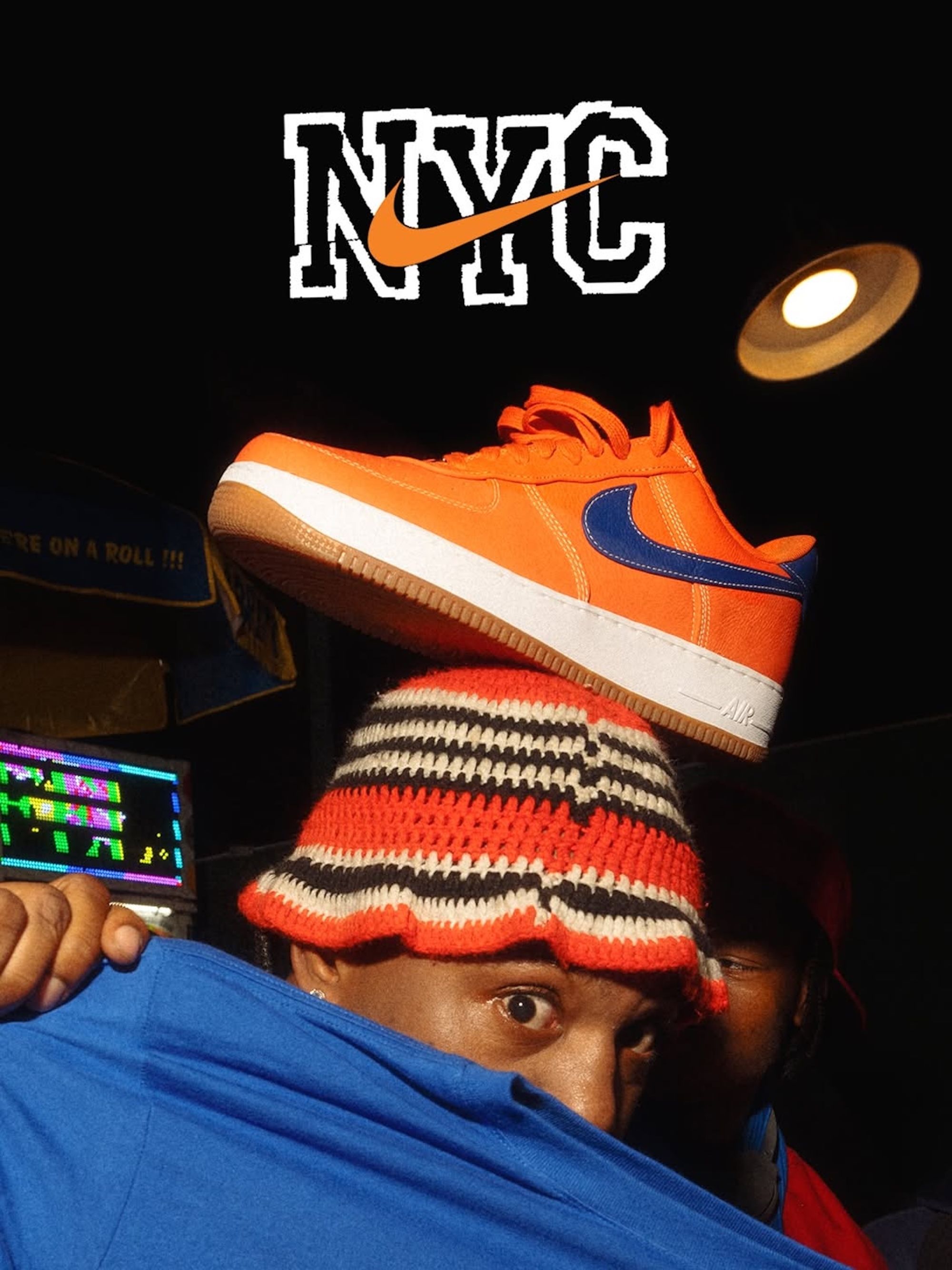 New York Knicks fan with the Knicks-inspired Nike NYC Air Force 1 in orange-and-blue.