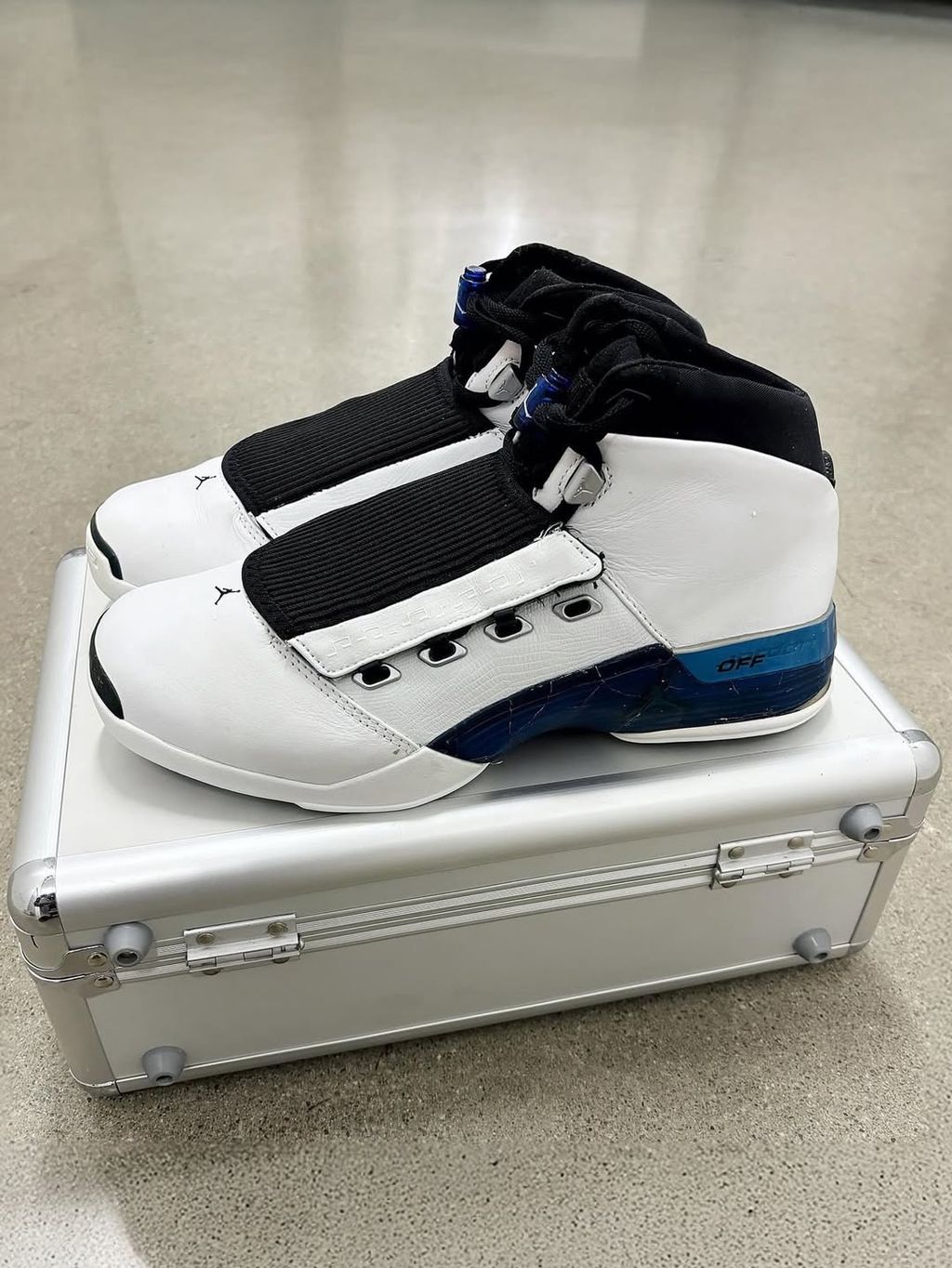 Air Jordan 17 College Blue colorway, full lateral view showing the classic 1999 silhouette in blue with neutral accents
