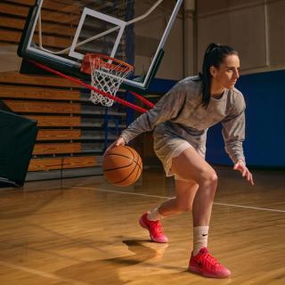 Caitlin Clark wearing the Nike Caitlin 1 "Midnight Fever" (SKU: IH7423-600). Photo via DICK'S Sporting Goods.