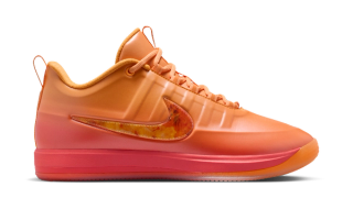 Nike Book 2 "Phoenix" basketball shoe in a "Sundial/Noir/Safety Orange/Medium Ash" color scheme.