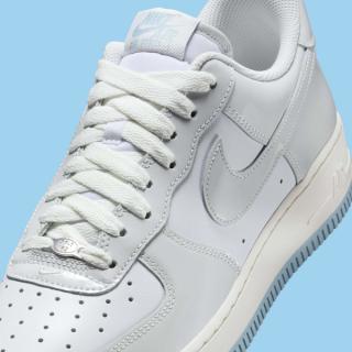 Close-up of Nike's Air Force 1 Low in a "White/Light Armory Blue/Photon Dust" color scheme.