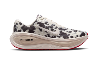 Nike Running's Vomero Plus "Cow Print" in a "Sail/University Red/Light Orewood Brown/Sail" color scheme.