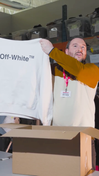 Ryan Bastien, Men's Apparel Buyer at Costco Canada, holding Off-White™ Hooded sweater.