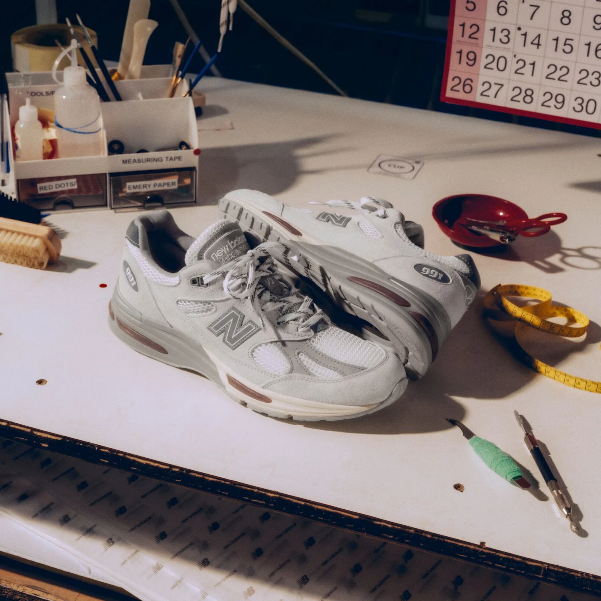 New Balance 991v2 Made in UK in a "Wind Chime/Brilliant White/Flint Gray" color scheme.