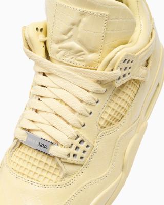 J Balvin x Air Jordan 4 "Lemonade" (SKU: IW2872-700). Photo via FOOTDISTRICT.