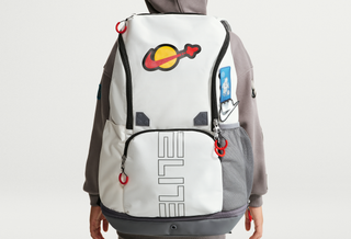 LEGO® x Nike Varsity Elite Backpack (32L) in a "Sail/Smoke Grey/Rush Red" color scheme.