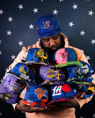 Jae Tips holding multiple New Era cap collaborations for NBA All-Star Weekend 2026.