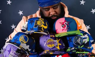 Jae Tips holding multiple New Era cap collaborations for NBA All-Star Weekend 2026.