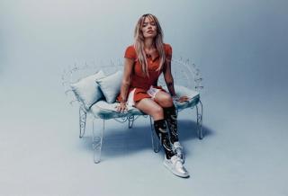 Karol G Wearing Silver Reebok Club C 85 Sneaker for Women.