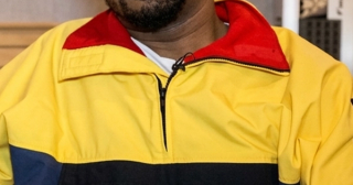 Just Blaze wearing Polo Ralph Lauren's "Snow Beach" Pullover Jacket in an interview about his and Packer Shoes' similar Saucony Grid 9000 collaboration from August 2014.