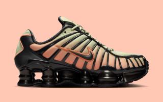 Medial angle of the Nike Shox TL in an "Off Noir/Olive Aura/Orange Frost" color scheme.