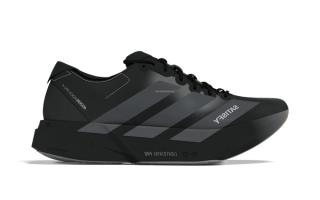 SATISFY® x adidas Adizero Adios Pro 4 running shoe collaboration in a "Core Black/Grey Five" color scheme.