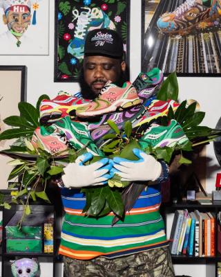 Jae Tips holding his multi-pair Saucony ProGrid Triumph 4 collection.