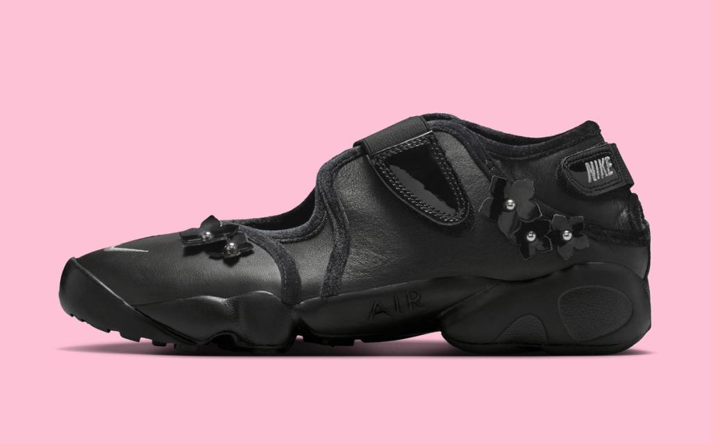 Nike Air Rift in dark floral colorway, showing the signature split-toe profile with botanical patterning across the upper