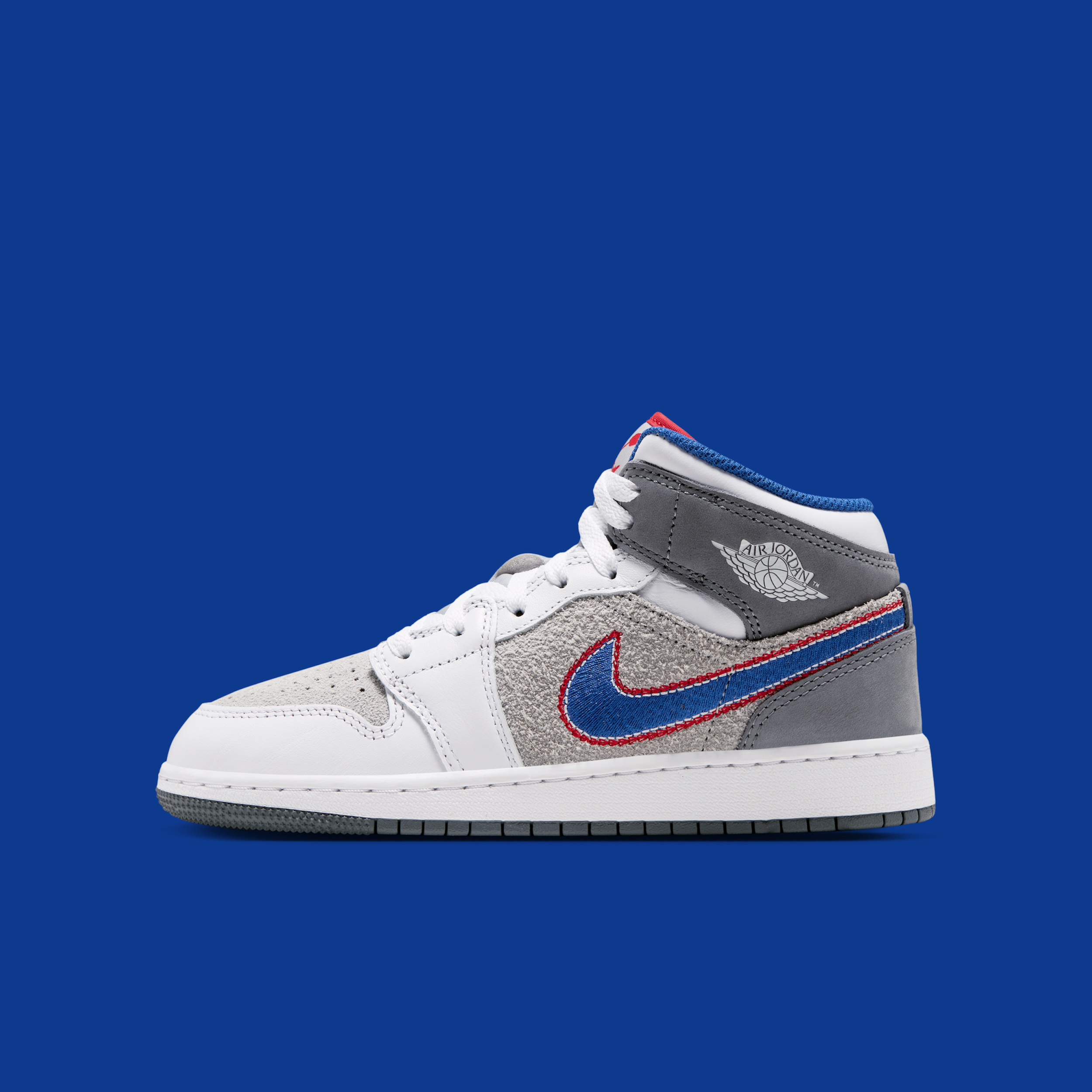 Big Kids's Space Jam x Air Jordan 1 Mid "Hare" (SKU: IZ4720-001). Photo via Nike.