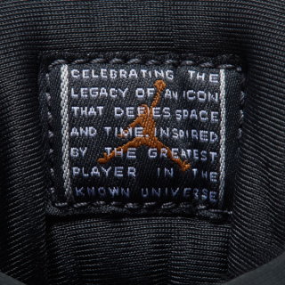 Women's Air Jordan 11 "Magic Ball" Tongue Tag (Space Jam; SKU: IZ1800-200). Photo via Nike.