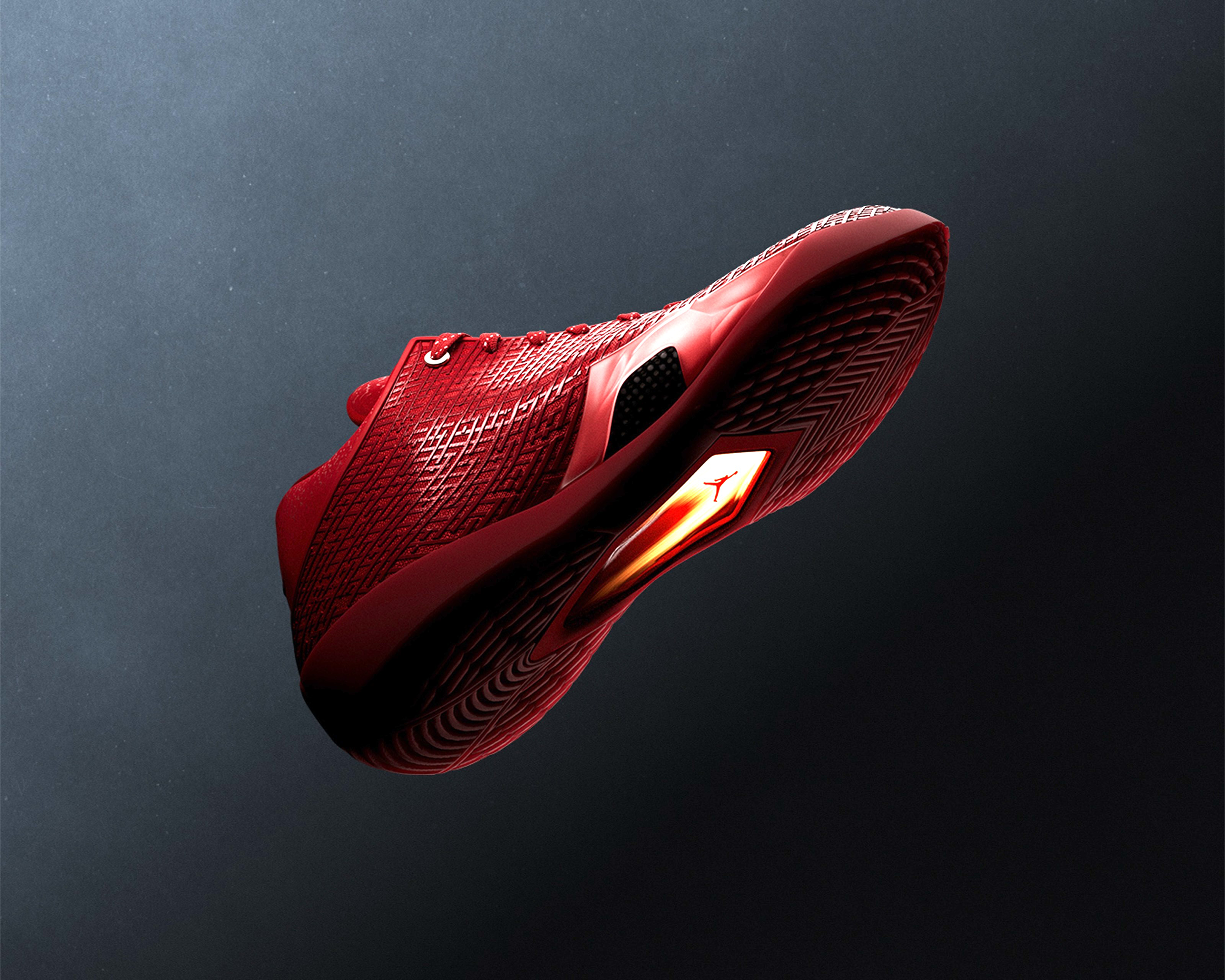 Air Jordan 41 basketball shoe in a "University Red/Infrared 23" color scheme inspired by the ruby gemstone.