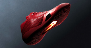 Air Jordan 41 basketball shoe in a "University Red/Infrared 23" color scheme inspired by the ruby gemstone.