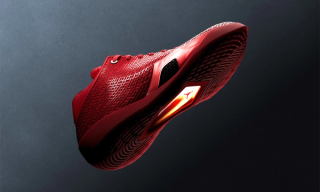Air Jordan 41 basketball shoe in a "University Red/Infrared 23" color scheme inspired by the ruby gemstone.