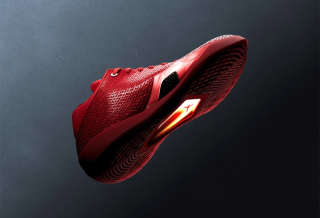 Air Jordan 41 basketball shoe in a "University Red/Infrared 23" color scheme inspired by the ruby gemstone.