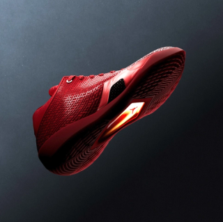 Air Jordan 41 basketball shoe in a "University Red/Infrared 23" color scheme inspired by the ruby gemstone.