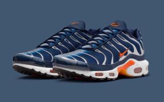 Nike Air Max Plus in a "Midnight Navy/Midnight Navy/Ashen Slate/Safety Orange" color scheme.