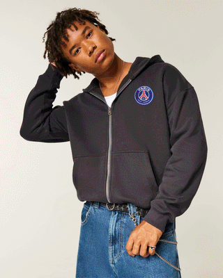 Paris Saint-Germain F.C. Graphic Zip-Up Hoodie. Photo via Hollister.