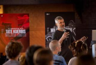 Tate Kuerbis speaking at SCAD SNKR Culture Week 2025.