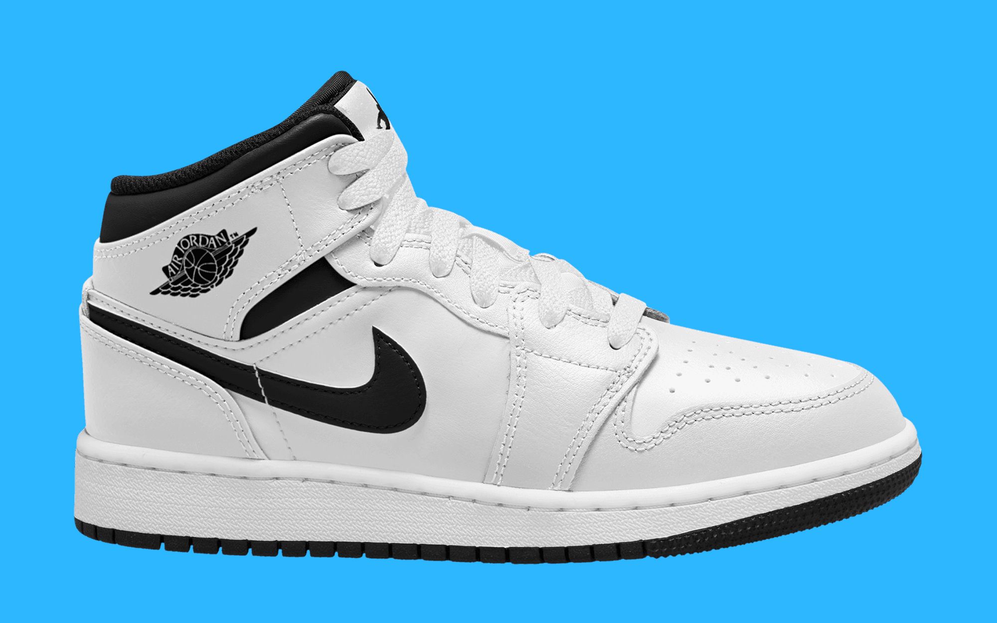 white jordans with black swoosh