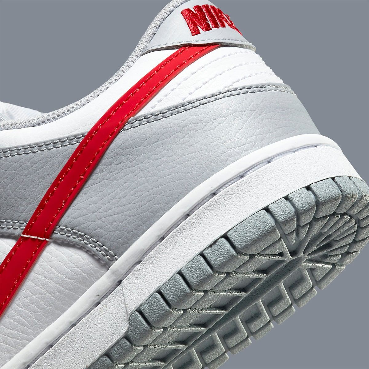 The Nike Dunk Low in Wolf Grey and University Red Arrives May 10