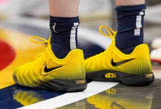 Caitlin Clark's Nike Caitlin 1 basketball shoe in a "Electric Green/Varsity Maize/Dusty Cactus/Chlorophyll/Racer Blue" color scheme. Photo via Caitlin Clark on Instagram Stories.