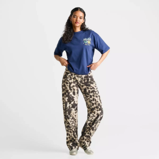 Women's cow print Unlike Human denim jeans exclusive to JD Sports.
