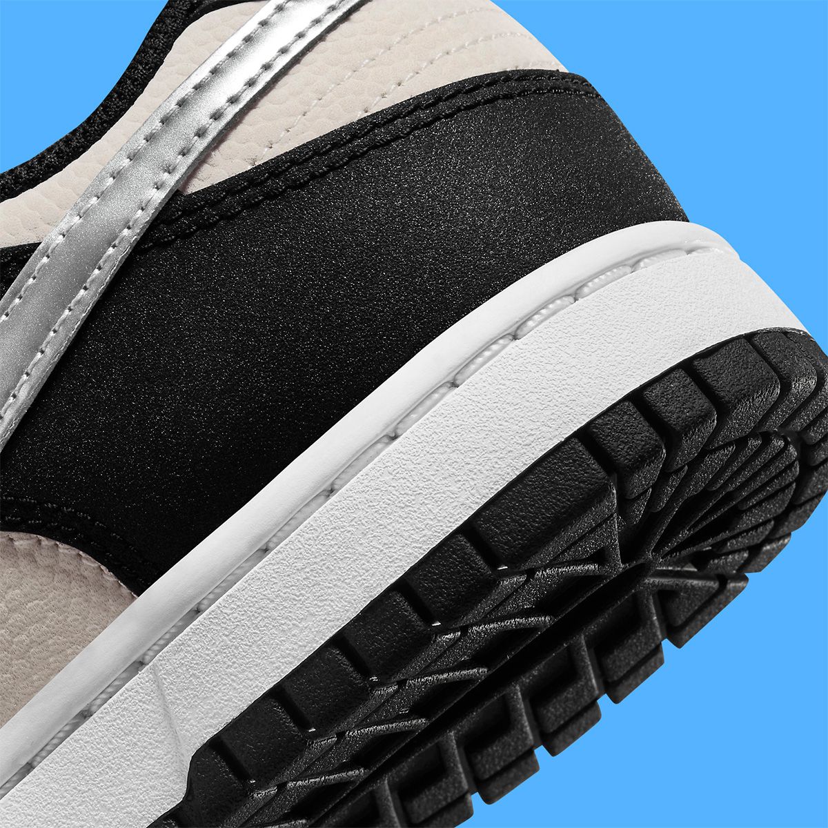 New Nike Dunk Low Boasts Bone, Black and Metallic Silver Finishes