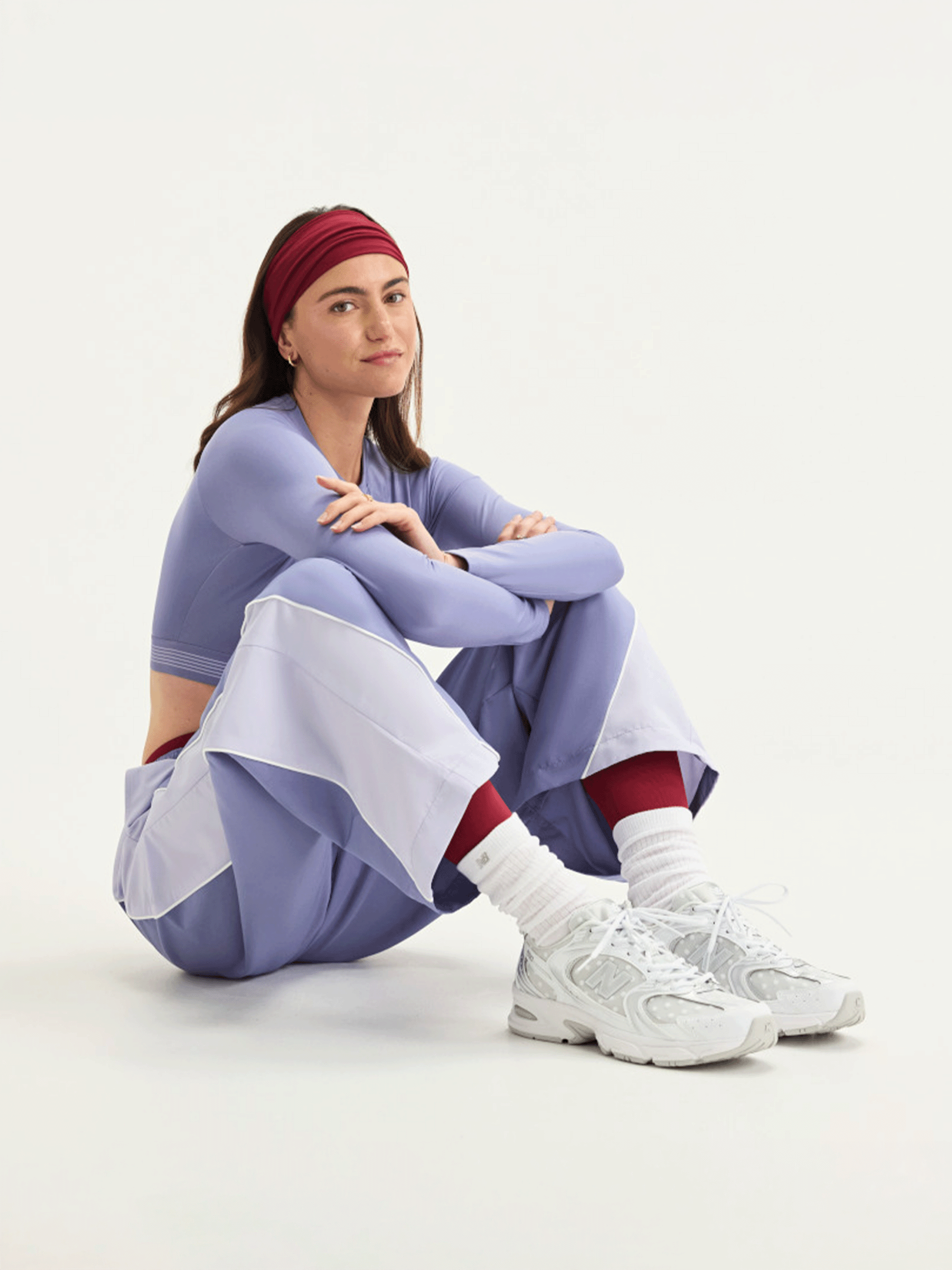 Women's polka dot-covered New Balance 530 in a clean "White/Silver Metallic" color scheme.