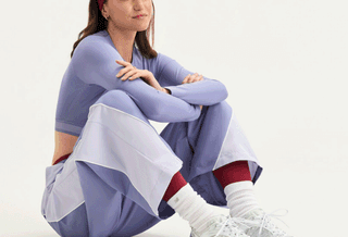 Women's polka dot-covered New Balance 530 in a clean "White/Silver Metallic" color scheme.